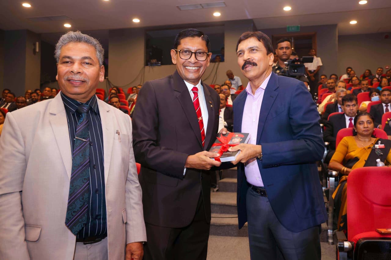 Major General (Retd) Milinda Peiris presenting a copy of Beyond Rank to Mr Bandara Dissanayake, Chairman and Managing Director of Saegis Campus and the Sakya Group of Higher Education.