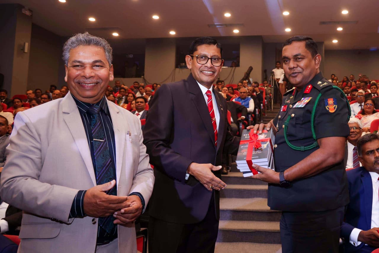 Major General (Retd) Milinda Peiris presenting a copy of Beyond Rank to Lieutenant General Nilantha Premaratne, Commander of the Sri Lanka Army.